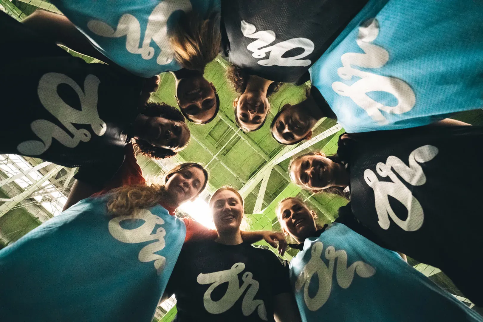 Players gather in a circle before the match