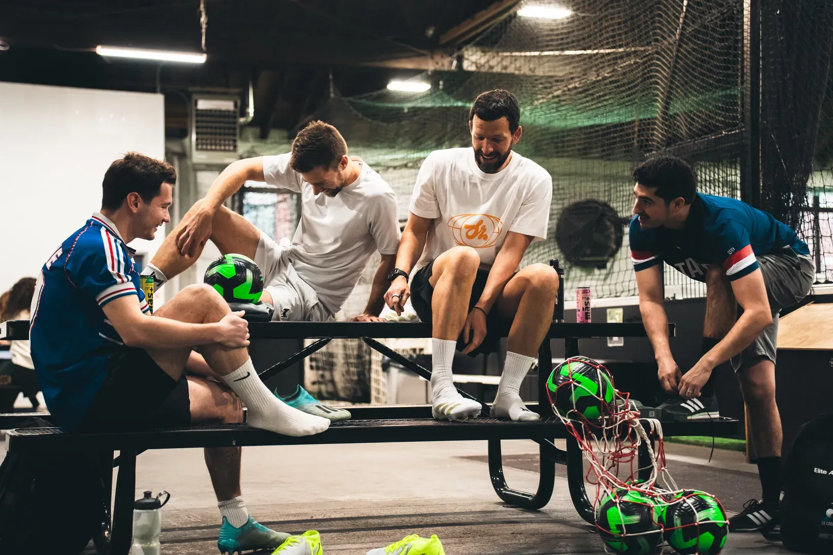 Friends chatting after a game of soccer