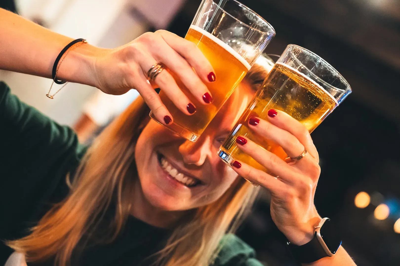 A woman raises her glass for an aperitif